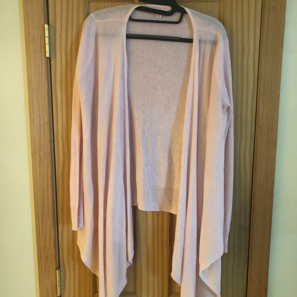 Cardigan. Longer in front. Fits like a medium